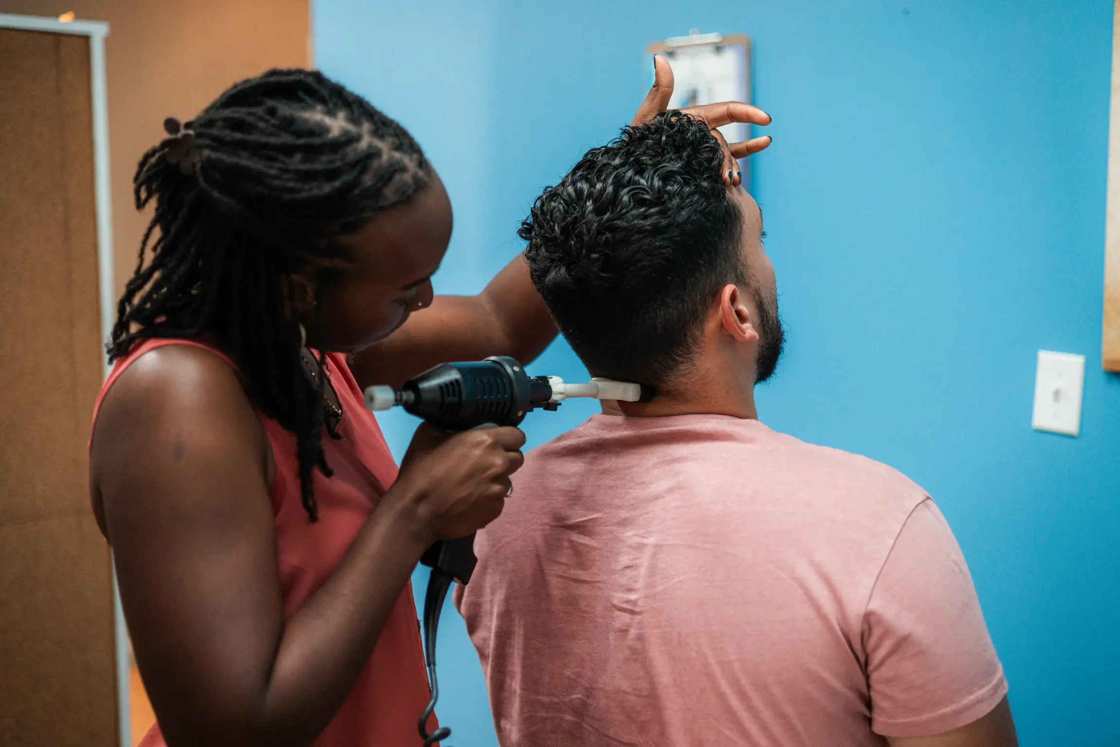 Chiropractor treating a patient's neck
