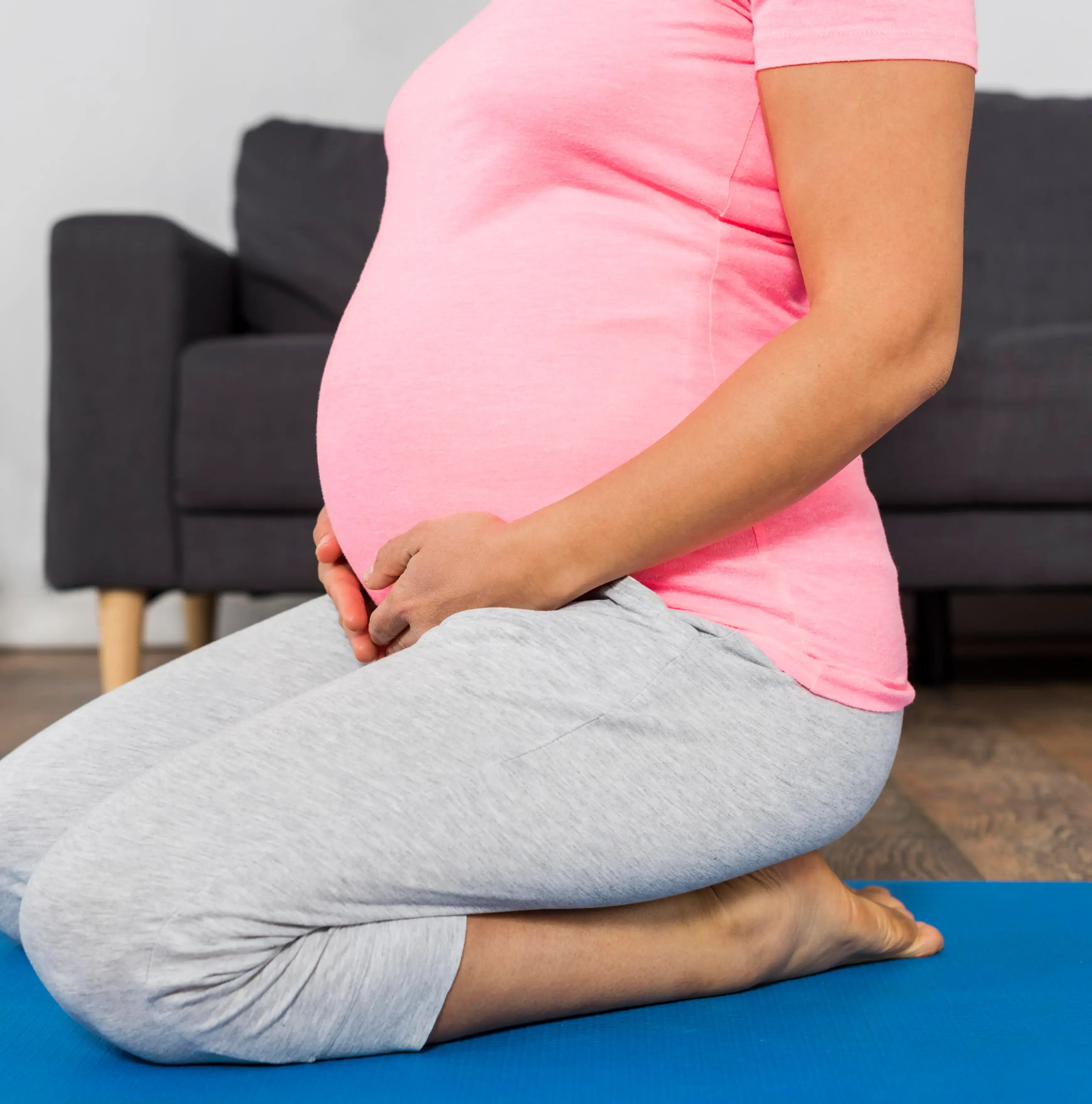 Expectant mother seated at home